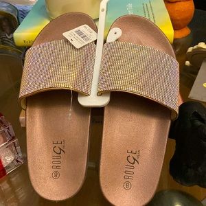Rose gold crystal slides.
